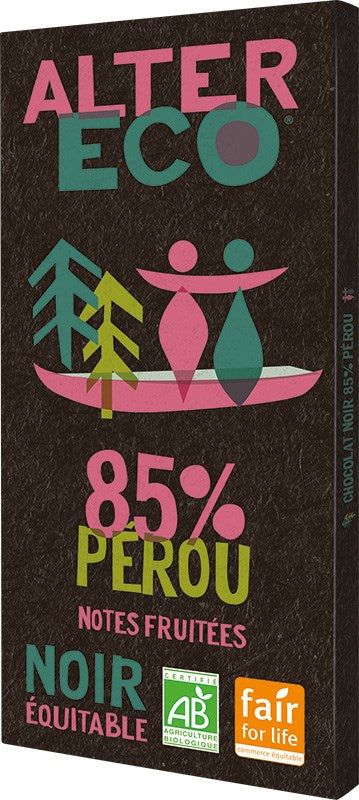 A chocolate bar labeled Alter Eco 85% Pérou Noir Équitable features colorful minimalist graphics of trees and figures, along with certification logos for organic and fair trade at the bottom. Packaging is a rectangular matte-finish wrapper in dark brown with a central area showing stylized illustrations. Typography is bold sans-serif, primarily white and yellow. Flatly lit studio shot; no people present.