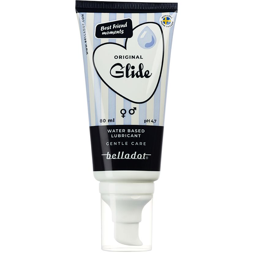 A tube of Belladot Original Glide water-based lubricant with a heart design, blue and white stripes, and an easy-pump dispenser. The tube is made of plastic with a matte finish, cylindrical in shape. Typeface on the label is bold and sans-serif. Visible text includes the brand name and product tagline. Product is shown isolated against a plain background in a studio shot.