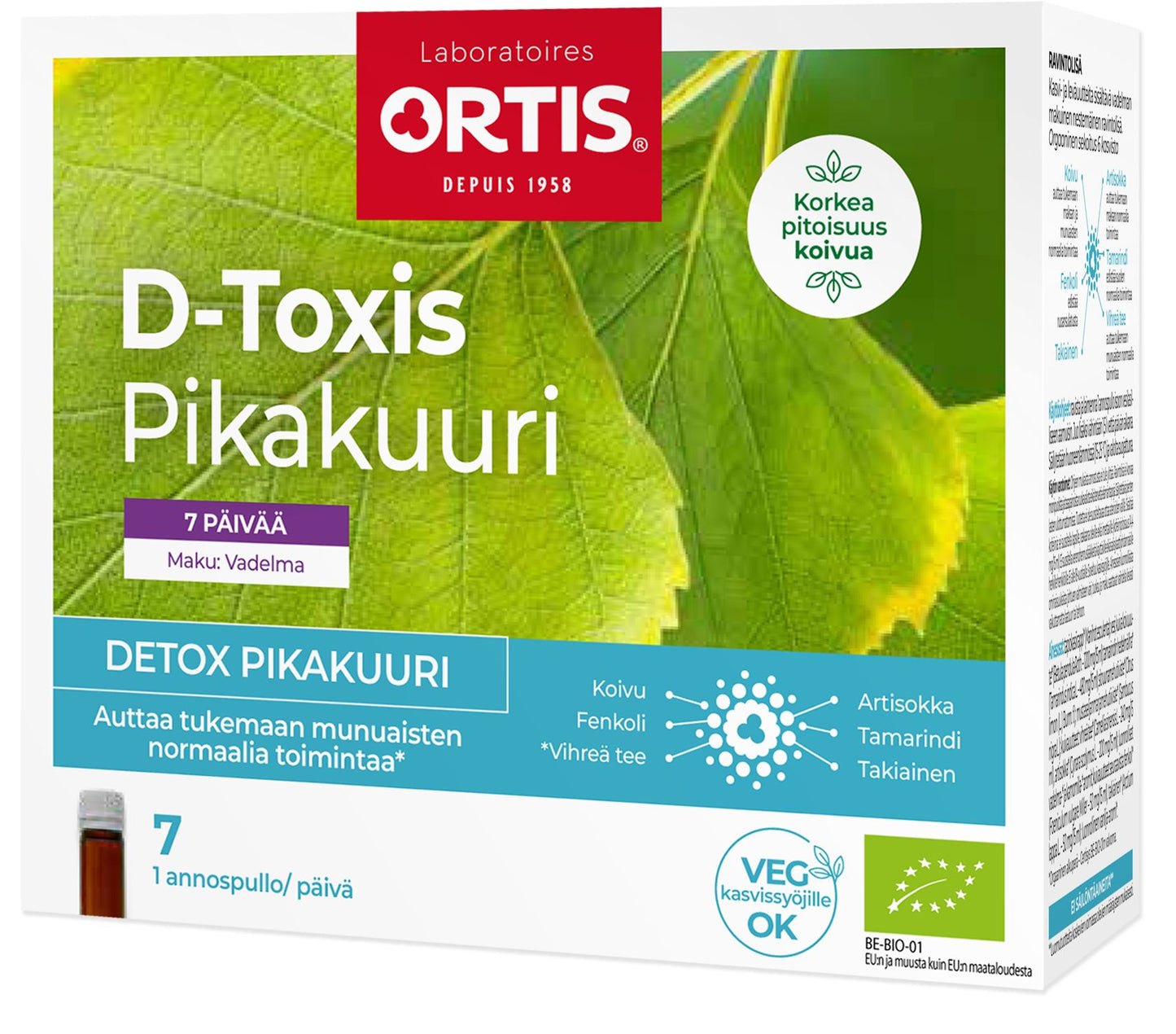 A box of Ortis D-Toxis Pikakuuri, a 7-day raspberry-flavored detox supplement, featuring leaf imagery and icons for vegan and plant-based suitability. The cardboard box is rectangular with a matte finish, predominantly white and pink, with green accents. Bold sans-serif typography is used for the product name. Text highlights support for kidney function and plant-based benefits. No hands or people visible; plain background; front-facing product shot.
