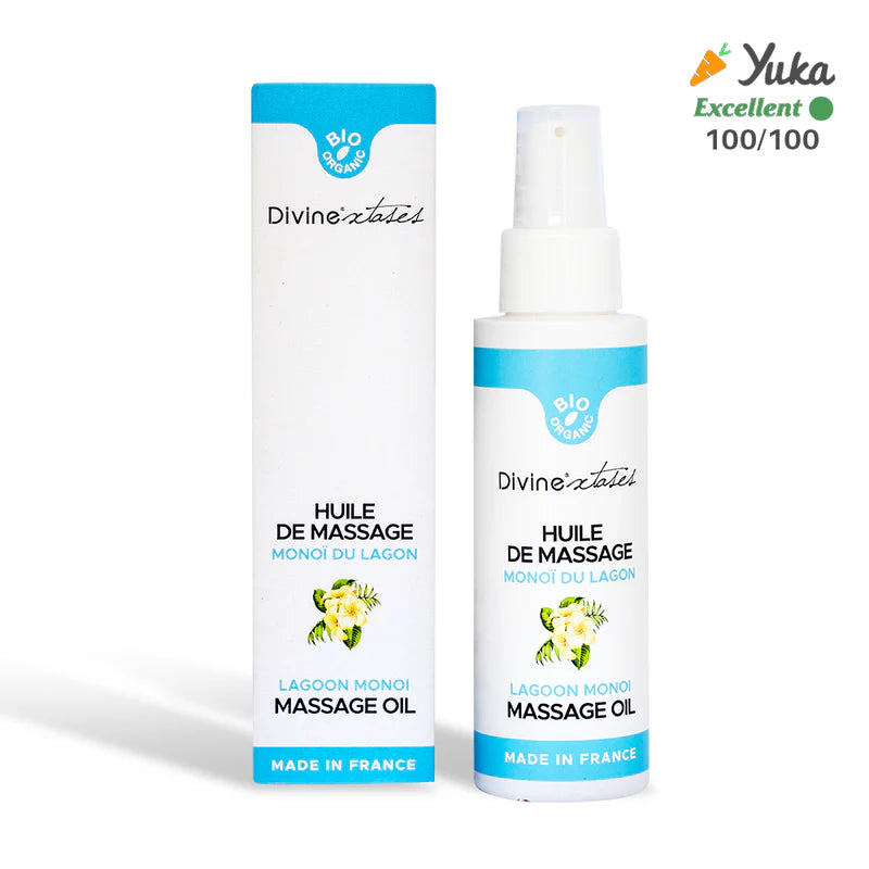 DivineXtases Monoi Hierontaöljy; valkoinen pullo ja rasia Divine extase Lagoon Monoi Massage Oil -hierontaöljyä, merkitty Huile de Massage, Made in France, rikastettu ravitsevalla monoilla; Yuka-luokitus Excellent 100/100 oikeassa yläkulmassa; molemmat esineet mattapintaisia selkeällä nykyaikaisella groteskikirjasimella; kuvassa näkyy vain pullo ja rasia tasaista taustaa vasten, ei ihmisiä tai muita esineitä.