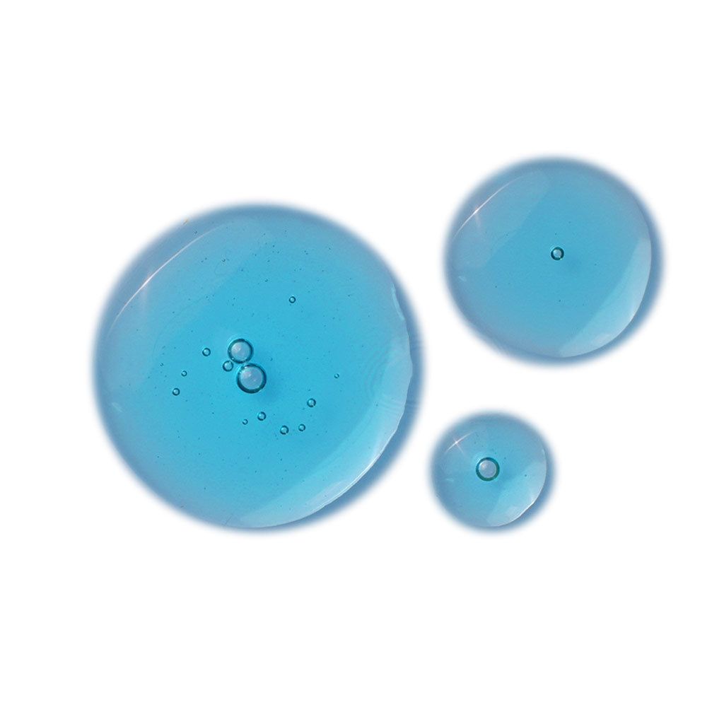 Three blue liquid droplets of varying sizes are placed on a white background, each with small air bubbles inside, creating a glossy, transparent appearance. No visible packaging or labels. Droplets are spherical and irregularly shaped. Surface is smooth and highly reflective. Image shows only the droplets; no people or objects present. Studio-style overhead shot with even lighting.