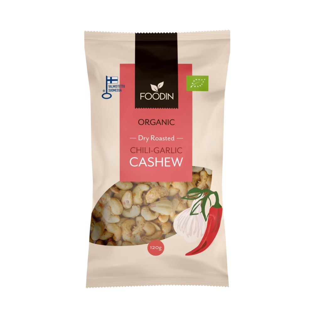 A bag of Foodin organic dry roasted chili-garlic cashew nuts. Stand-up pouch with matte beige and red color blocks, front displays illustrations of cashews, a whole red chili, and a garlic bulb. Bold sans-serif product name near top; “120g” and European organic logo shown on lower half. Plain background, no people visible.