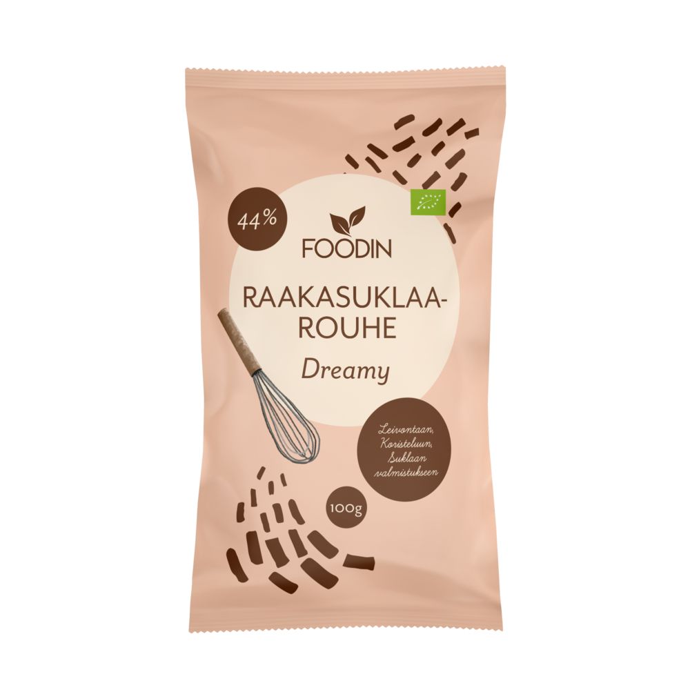 A pink 100g package labeled FOODIN Dreamy Raakasuklaarouhe with 44% cocoa. The matte pouch is rectangular with a sealed top, front-facing in the image. Design includes a simple line-drawn whisk and small illustrated chocolate pieces near the bottom. Label text uses bold uppercase sans-serif font; additional text appears in smaller lettering below. Plain light background, no people visible.