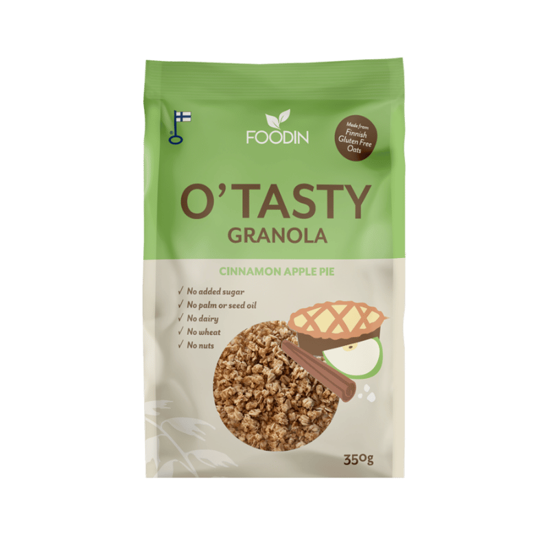 Foodin O'Tasty Kauragranola Cinnamon Apple Pie, 350 g; mattapintaisessa taipuisassa pakkauksessa kuvia granolasta, paistetusta piirakasta, kanelitangoista ja omenaviipaleesta; päätekstissä lihavoitu groteskikirjasin, pienemmät kuvakkeet kertovat tuotteen olevan sokeriton, pähkinätön, maidoton sekä palmu- ja siemenöljytön; yksivärinen tausta, ei ihmisiä näkyvissä.