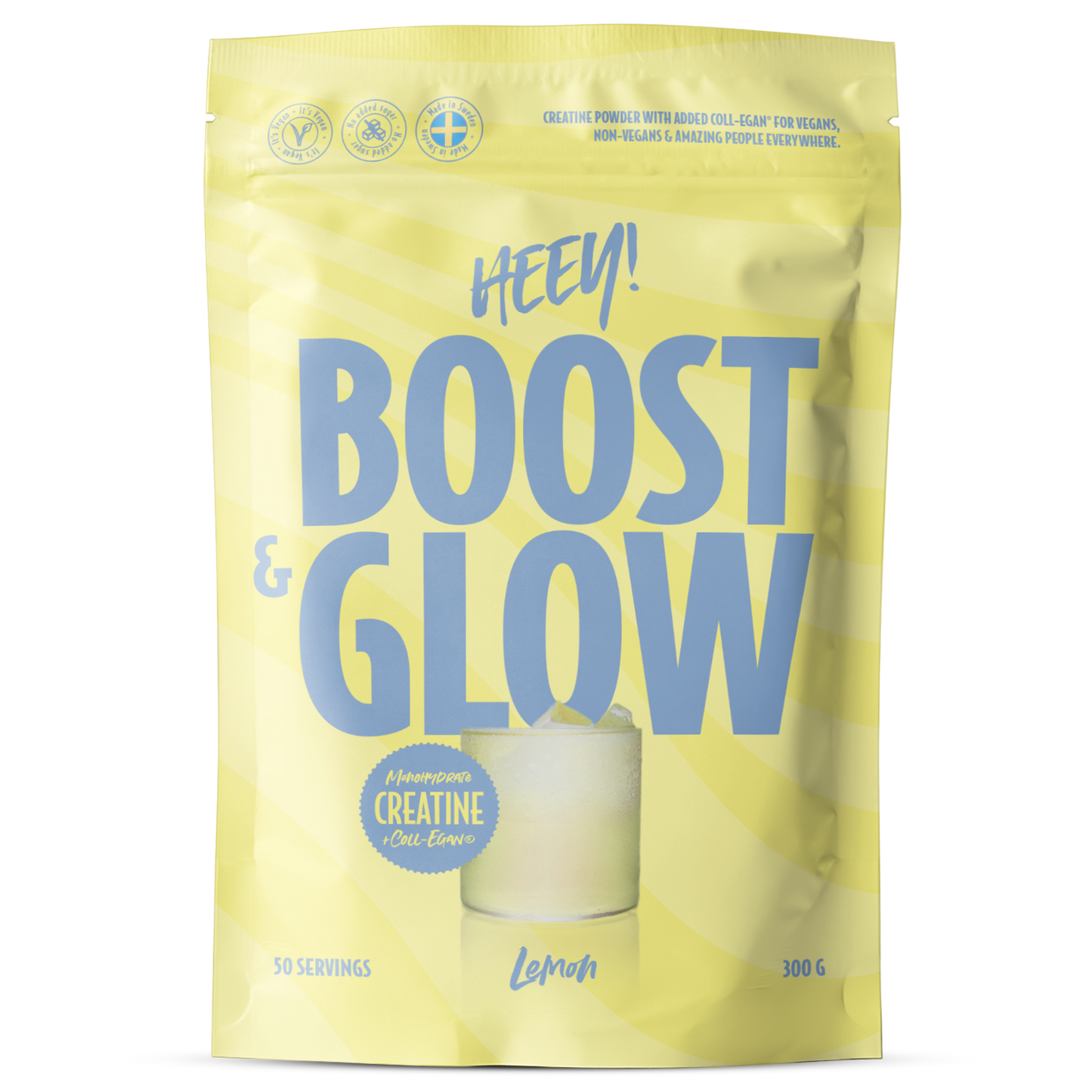 Heey! Boost & Glow Creatine + Coll-egan®, Lemon; keltainen pussi, jossa lukee HEEY! BOOST & GLOW sinisellä tekstillä; mattapintainen, joustava suorakulmainen pakkaus; tuotetiedoissa mainitaan kreatiini ja sitruunan maku, 50 annosta ja 300 g; etupuolen kuvassa lasi keltaista urheilujuomaa; tausta valkoinen ja yksivärinen, ei muita esineitä tai ihmisiä kuvassa.