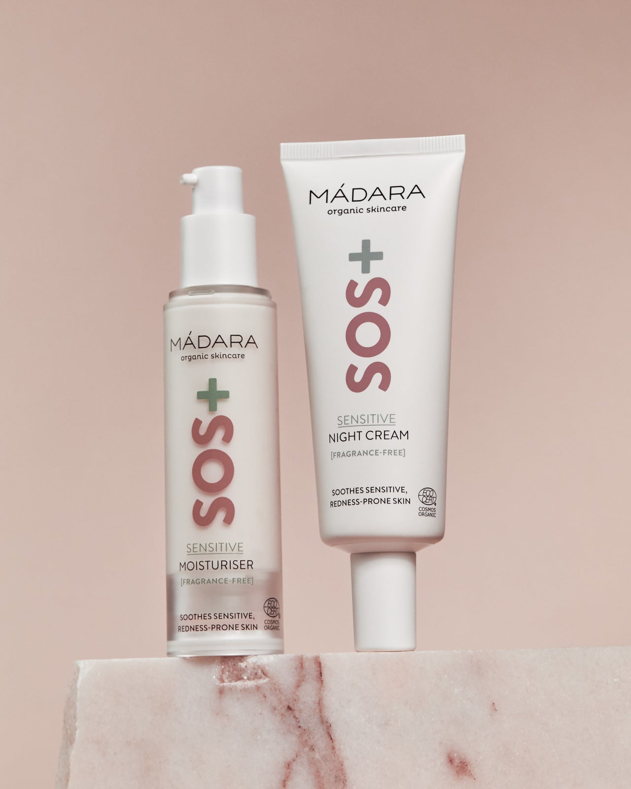 Madara SOS+ SENSITIVE Moisturiser ja Night Cream vaaleanpunaisella taustalla