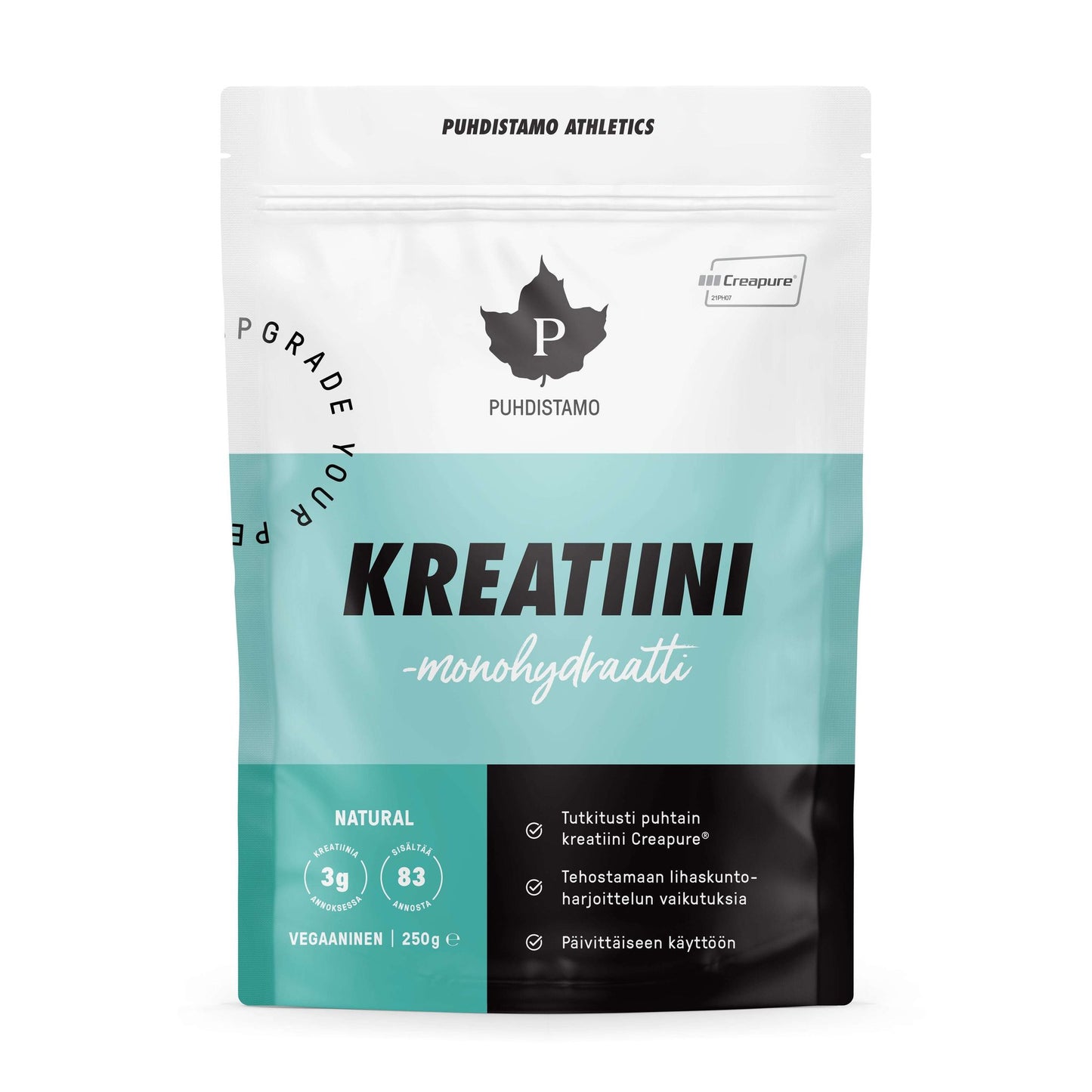 Puhdistamo Kreatiini-monohydraatti; valkoinen ja turkoosi pussi Puhdistamo Kreatiini monohydraatti -kreatiinijauhetta; pakkaus joustavaa materiaalia mattapintaisena ja yläsaumasuljettuna; tuotenimi painettu lihavoidulla mustalla ja turkoosilla kirjasimella etupuolelle; luettava teksti kertoo 3 g kreatiinia annosta kohden, 83 annosta ja vegaaniystävällisyyden; pussi pystyssä vaalealla taustalla, ei ihmisiä kuvassa.