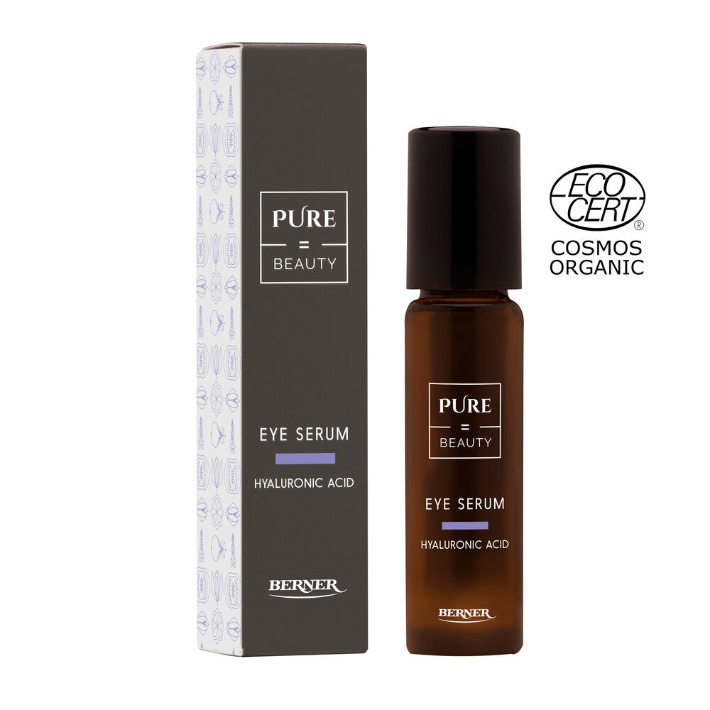 Pure=Beauty Eye Serum, hyaluronihappoa sisältävä silmänympärysseerumi Bernerin ruskeassa pullossa ja pakkauksessa, oikealla ECOCERT Cosmos Organic -sertifikaattilogo valkoisella taustalla korostaen luomukoostumusta; pullo ruskea ja mattapintainen, sylinterimäinen, pakkaus suorakaiteen muotoinen selkeällä typografialla; molemmissa tuotenimi, pääainesosa, brändi ja sertifikaattimerkki; ei ihmisiä eikä käsiä näkyvissä.