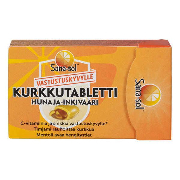 A box of Sana-sol Kurkkutabletti lozenges in honey-ginger flavor. The packaging is rectangular, orange, appears to be made of cardboard with a matte finish. Juicy orange slices are pictured on the front. Finnish text is printed in bold, sans-serif typeface. The shot focuses on the product against a plain background; no people or other objects visible.