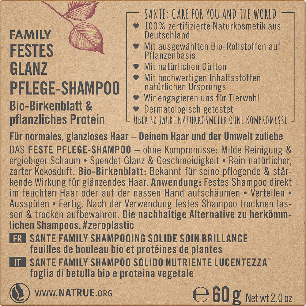Sante Family Solid Shine Care Palahampoo; pakkaus tekstillä saksaksi, englanniksi, ranskaksi ja italiaksi; suorakulmainen laatikko mattapinnalla, pääväreinä beige ja vihreä; lihavoitua groteskitypografiaa tuotenimessä, pienempää tekstiä ominaisuuksille; kuvakkeet osoittavat kestävyyttä ja luonnonmukaisia ainesosia; nettopaino 60 g painettuna selkeästi etuosaan; ei ihmisiä tai käsiä näkyvissä, tausta yksivärinen, kuva suoraan edestä.