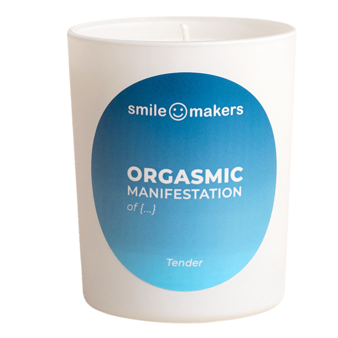 A white candle with cylindrical shape and a smooth matte surface sits upright. The blue label displays sans serif text: âsmile makers and Tenderâ plus âORGASMIC MANIFESTATION of pleasure.â There is no lid or visible packaging. The candleâs wick is intact and unburned. The background is plain, with neutral lighting. No people or other objects are present.