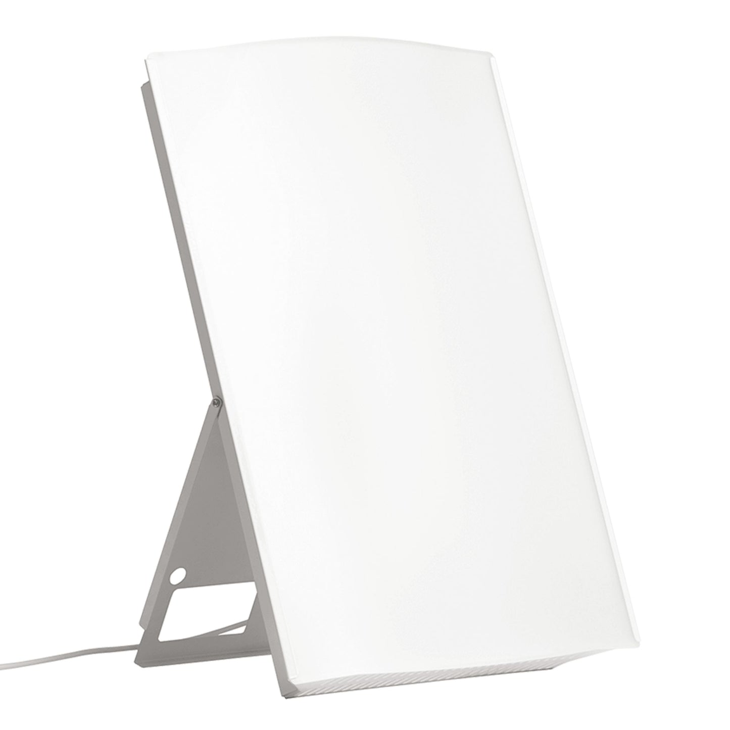 A white rectangular light therapy lamp with a thin frame, standing upright on a fold-out support with a power cord attached, provides bright LED illumination. Matte finish on front and frame; no visible logos or label text. No packaging shown. Plain background in neutral color, tabletop surface visible. No hands or people present. Standard product shot, straight-on angle.