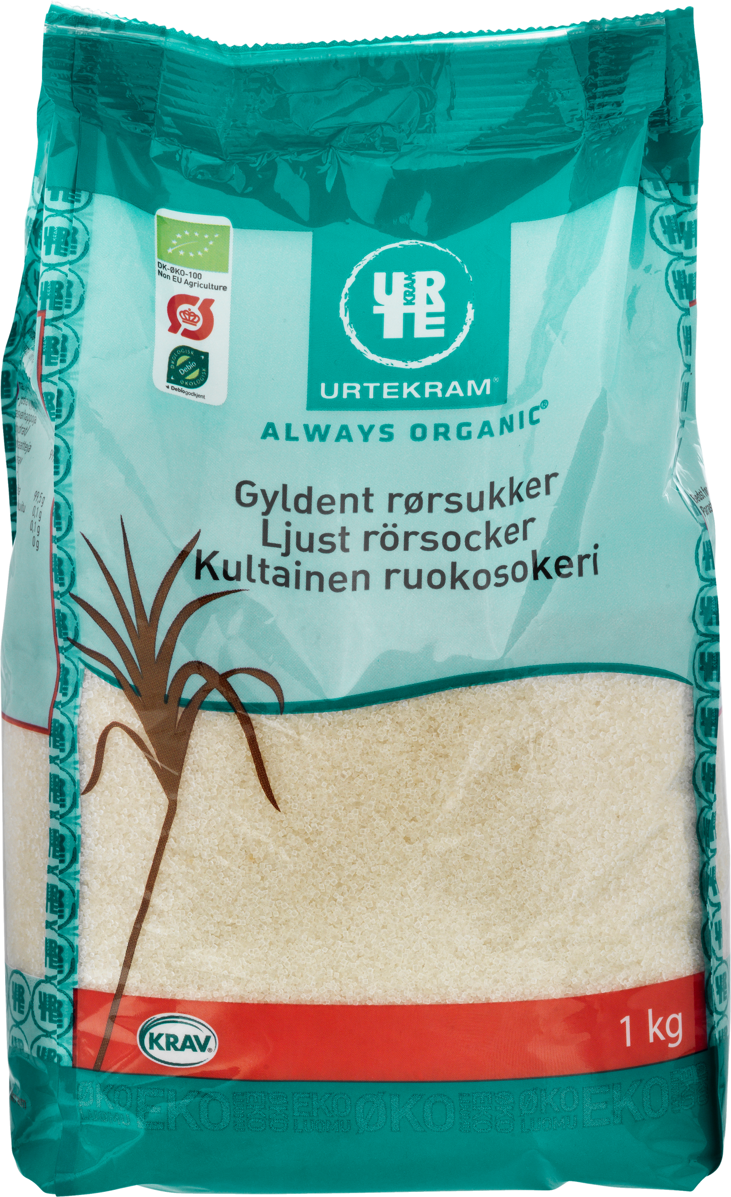 Urtekram Luomu Kultainen Ruokosokeri, 1 kg pussi luomu vaalealle ruokosokerille turkoosin ja punaisen pakkauksen kera, monikielistä tekstiä ja sokeriruokokuvitusta; pakkaus mattapintaista muovia suorakulmainen muoto, lihavoitu groteskitypografia brändinimelle; teksti sisältää painon ja tuotetiedot; kuvassa vain tuote valkoista taustaa vasten, ei ihmisiä eikä käsiä näkyvissä.