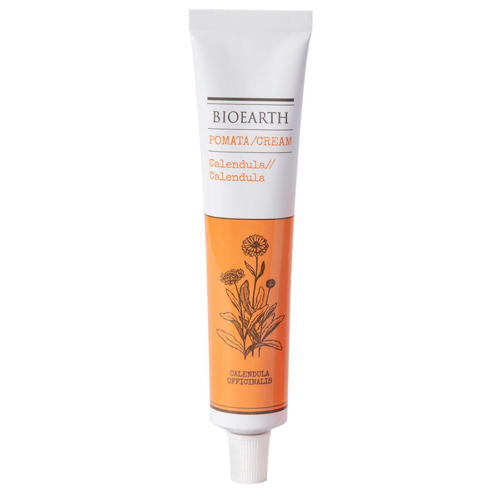 A tube of Bioearth Pomata Cream with calendula, featuring a white cap, orange and white label, and a black calendula flower illustration on the front. The tube is upright. The label has sans-serif text in black and orange detailing the product name and ingredients. The surface is matte. Background is plain white with no additional items or people visible. Shot is well-lit, straight-on product photo.