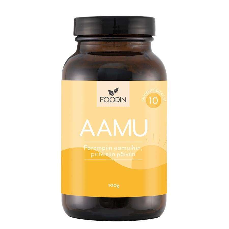 Foodin Aamu Jauhesekoitus; ruskea purkki keltaisella etiketillä tekstillä "FOODIN AAMU 100g" ja auringonnousukuvitus; purkki lieriömäinen mattapinnalla ja kierrekannella; mustaa ja valkoista groteskitekstiä hallitsevana, lisäksi pienempää suomenkielistä tekstiä; tausta valkoinen; ei ihmisiä tai käsiä kuvassa.