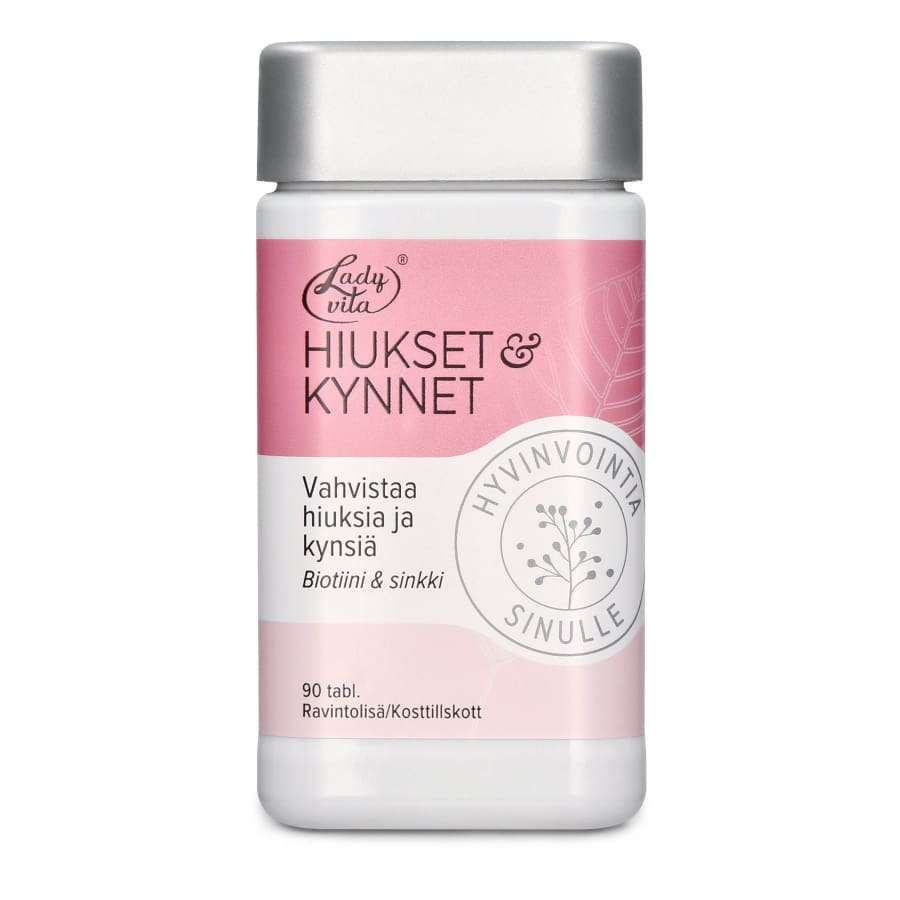 Ladyvita Hiukset & Kynnet; pullo LadyVita Hiukset & Kynnet -ravintolisää vaaleanpunaisella ja valkoisella etiketillä; muovipullo lieriömäinen, valkoinen mattainen kierrekorkki; etiketissä lihavoitua, groteskia mustaa ja valkoista tekstiä, sisältää maininnan biotiinista, sinkistä, hiuksista, kynsistä ja 90 tabletista; tuote kuvattu vaaleaa taustaa vasten ilman ihmisiä tai rekvisiittaa kuvassa.