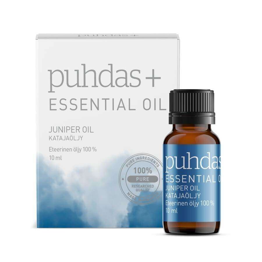 Puhdas+ Essential Oil Juniper Oil -pullo, 10 ml, pakkauksensa edessä, joka on valkoinen sinisin korostuksin ja merkitty 100-prosenttisesti puhtaaksi ja tutkitusti laadukkaaksi katajaöljyksi; pullo tummanruskeaa lasia valkoisella kierrekorkilla, sylinterimäinen muoto ja mattapinta; laatikko suorakulmainen selkein linjoin; tekstausvapaata typografiaa sekä etiketissä että laatikossa; tausta valkoinen, ei ihmisiä tai muita esineitä näkyvissä; suora tuotekuva.