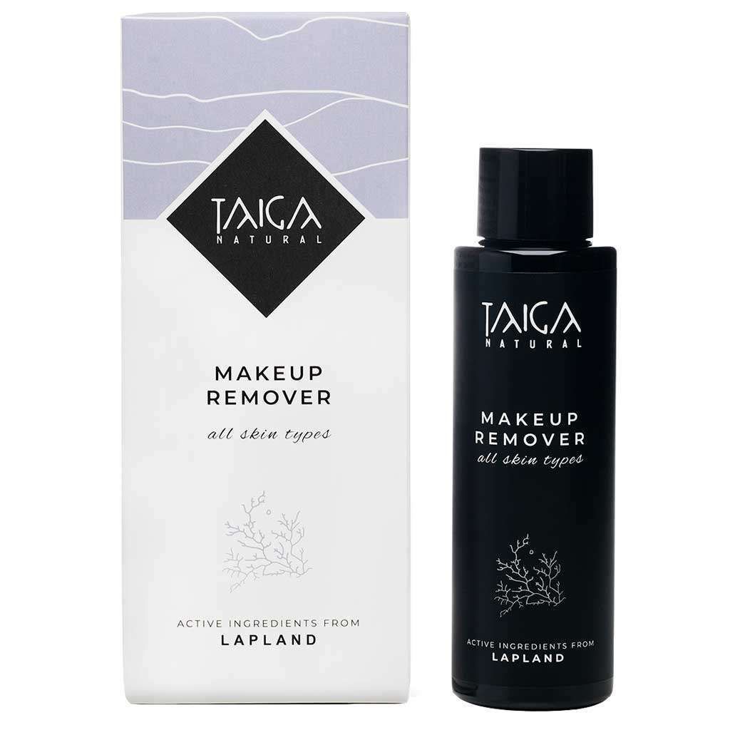 Taiga Cosmetics Meikinpoistoaine Kaikille Ihotyypeille; pullo ja rasia Taiga Natural Makeup Remover -tuotetta kaikille ihotyypeille, minimalistinen musta-valkoinen pakkaus arktisin vaikuttavin ainesosin Lapista; pullo lieriömäinen mattavalkoisella pinnalla ja mustalla korkilla; rasia suorakulmainen, myös mattavalkoinen mustin geometrisin tekstein; etiketissä tuotenimi, käyttö ja ainesosien alkuperä; valkoinen tausta, ei ihmisiä tai käsiä kuvassa.