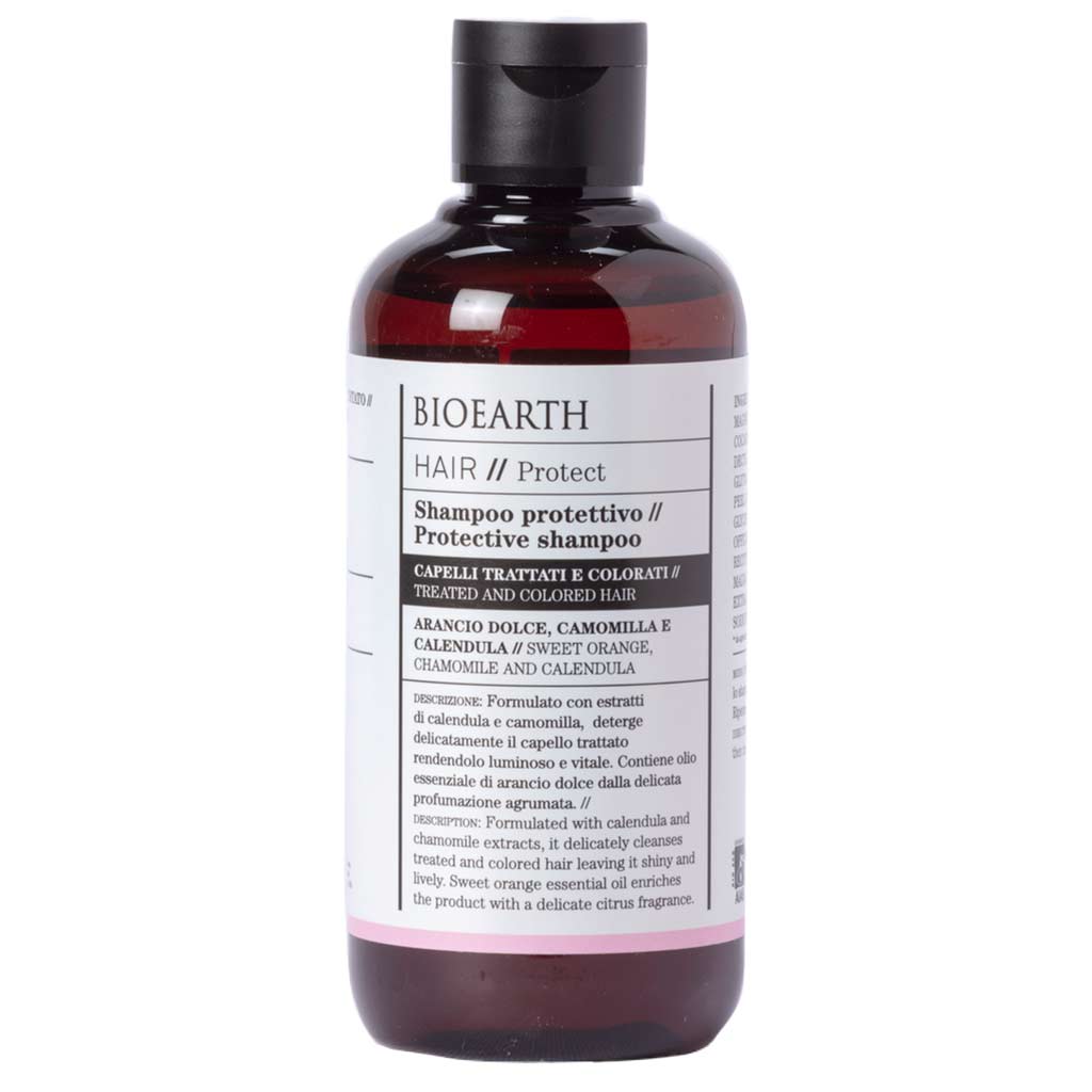 Bioearth HAIR 2.0 Shampoo käsitellyille ja värjätyille hiuksille; valkoinen, lieriön muotoinen ja kiiltäväpintainen muovipullo kirkkaalla korkilla; sisältää makean appelsiinin, kamomillan ja kehäkukan uutteita; musta groteskiteksti italiaksi ja englanniksi valkoisella taustalla; ei ihmisiä tai käsiä.