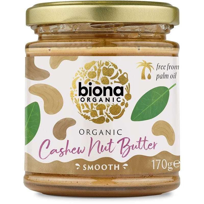 Biona Luomu Cashewtahna -purkki, 170 g; kirkas sylinterinmuotoinen lasipurkki metallisella kierrekannella, tumma mattapintainen etiketti cashewkuvituksella ja kultaisella logolla, palmuöljytön ja luomu