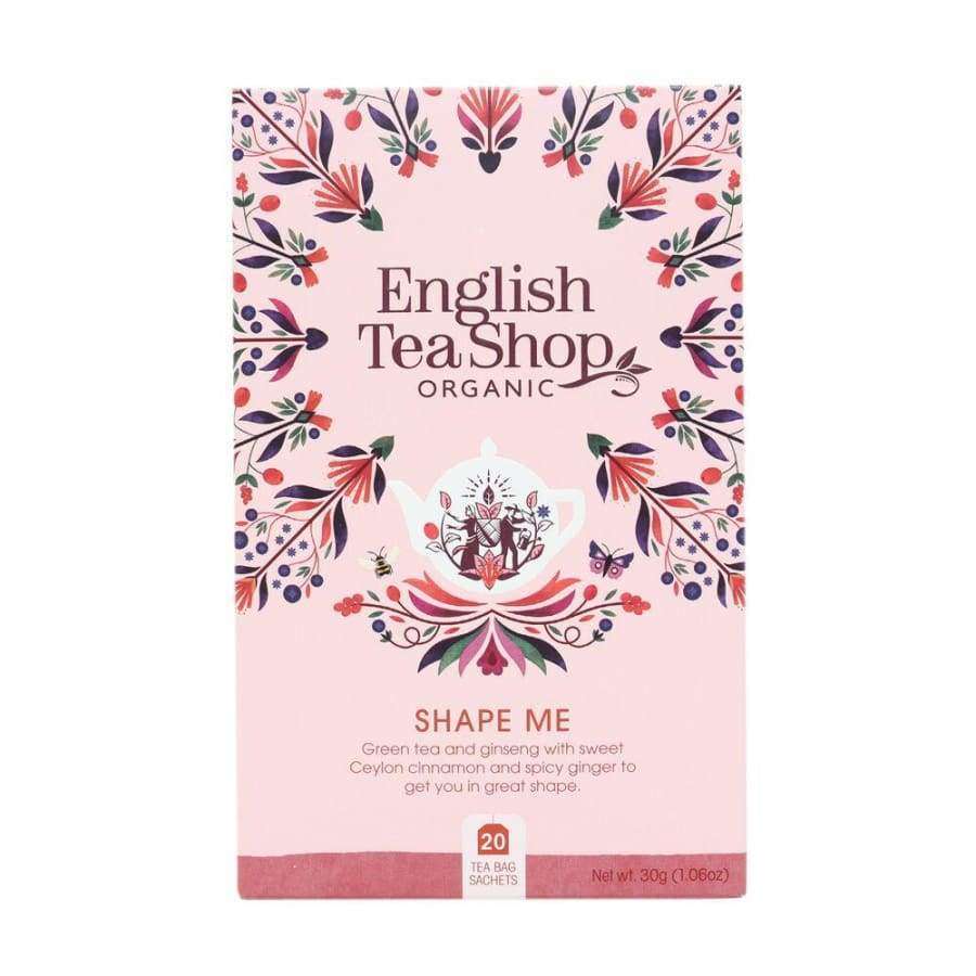 English Tea Shop Luomu Shape Me Tee; suorakulmainen rasia, väriltään pääosin mintunvihreä, mattapinta, monivärisiä kukkakuvioita; etiketissä serif-fontilla tekstiä vihreästä teestä, ginsengistä, Ceylon-kanelista, inkiväristä sekä 20 luomuteepussista; ei ihmisiä tai käsiä; vaalea tausta, tuote keskitetty kuvassa.