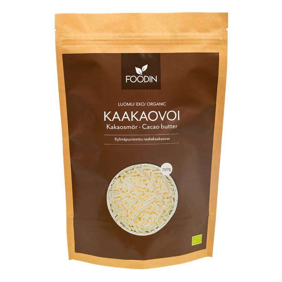 Foodin Luomu Kaakaovoi -pussi, 750 g, raaka; ruskea mattapintainen seisova pussi kirkkaalla vetoketjusaumalla yläreunassa, valokuva epätasaisista kaakaovoipaloista, groteskiteksti suomeksi, ruotsiksi ja englanniksi