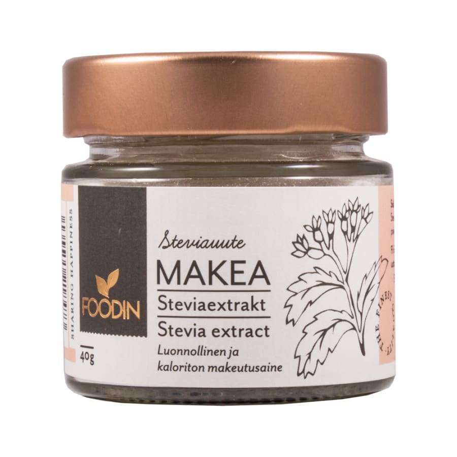 Foodin Stevia-uute, 40 g; pieni purkki, kuparinvärinen sileäpintainen metallikansi; lieriömäinen, kirkasta lasia; mattapintainen etiketti, mustaa ja vihreää painojälkeä, lohko- ja käsialafonttia, steviakasvin kuvitus; suomen- ja englanninkielistä tekstiä; vaalea tausta, ei ihmisiä.