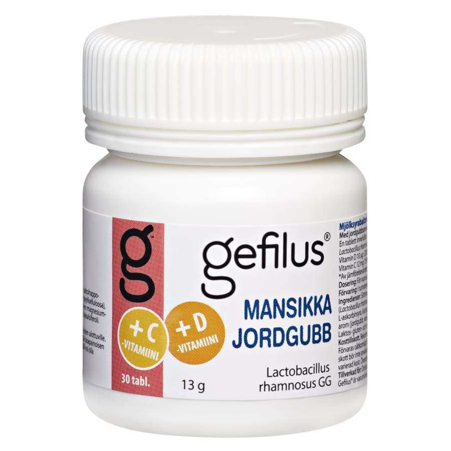 Gefilus-tablettipullo, valkoinen muovipullo kierrekorkilla ja kiiltäväpinnalla, sylinterimäinen muoto; etiketissä teksti +C +D-vitamiini, Mansikka Jordgubb sekä Lactobacillus rhamnosus GG; etiketin värit pääosin valkoisia punaisin ja muin tekstinvärikorostuksin; ei ihmisiä tai käsiä näkyvissä; tausta yksinkertainen, tuote keskitettynä kuvassa.