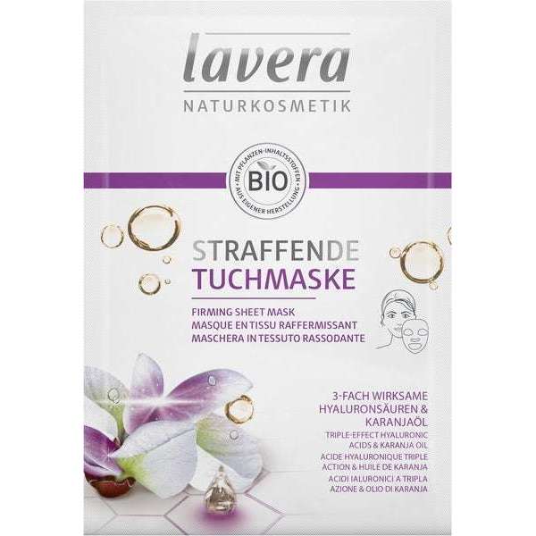 Lavera Firming Sheet Mask Kiinteyttävä kasvonaamio; pakkaus violetein tehostein, kuvituksena kukka ja öljypisaroita; teksti mainitsee hyaluronihapot ja karanjaöljyn; valkoinen pakkaus BIO-merkinnällä yläreunassa; suorakulmainen mattapintainen pussi, pääteksti groteskikirjasimella; valkoinen tausta, ei ihmisiä tai käsiä kuvassa.