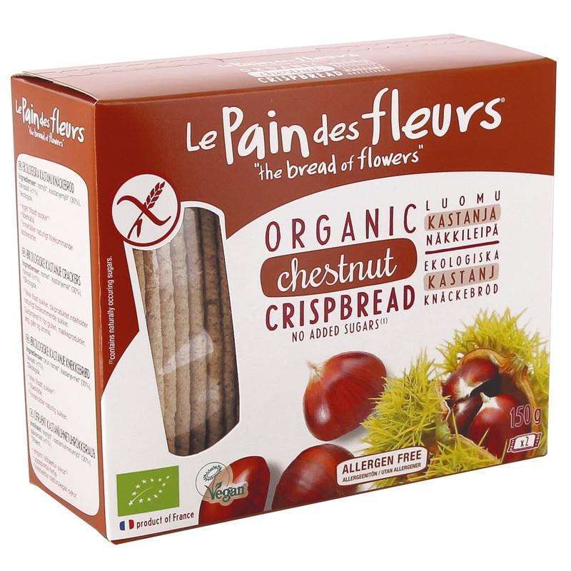 Le Pain des Fleurs Luomu Gluteeniton Näkkileipä Kastanja; rasia tekstillä "Le Pain des Fleurs" luomukastanjanäkkileipää, tuotekuvin, kastanjoin ja sertifiointilogoin pakkauksessa; rasia suorakulmainen kiiltäväpinnalla, pääosin valkoinen ja ruskea väriteema; etuosassa näkkileipiä, kokonaisia kastanjoita, tyylitelty teksti lihavoidulla groteskifontilla sekä useita pyöreitä tai suorakulmaisia sertifiointimerkkejä; tausta neutraali, ei ihmisiä tai käsiä; tavanomainen etukuva.