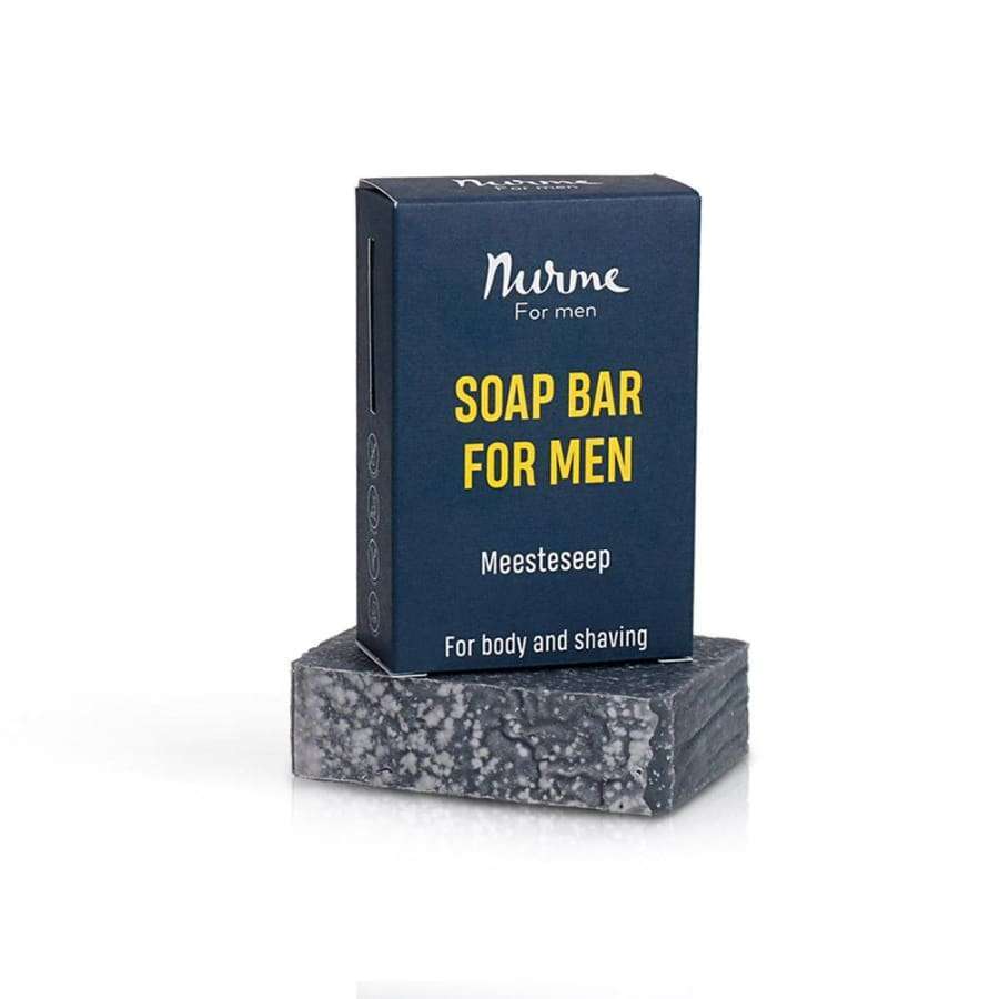 Nurme Palasaippua Miehille -saippuapala ja pakkaus, tumma suorakulmainen palanen, tummansininen mattapintainen rasia; teksti "For body and shaving" englanniksi ja viroksi