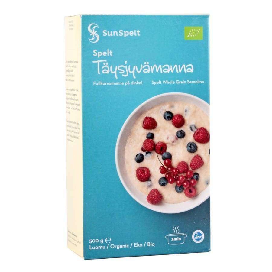 SunSpelt Luomu Täysjyvämanna -pakkaus, sininen, kuva speltvehnämannapuurosta vadelmin ja mustikoin; mattapintainen rasia, teksti suomeksi, ruotsiksi ja englanniksi, 500 g