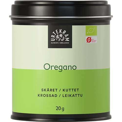 Urtekram Luomu Oregano; peltirasia tekstillä "Urtekram" luomuoreganoa, 20 g, mattavihreä ja valkoinen etiketti tuotenimellä useilla kielillä; musta muovikansi peittää suorakulmaisen metallirasian yläosan; pääteksti groteskifontilla; vaalea valkoinen tausta ilman lisärekvisiittaa tai ihmisiä; keskitetty tuotekuva.
