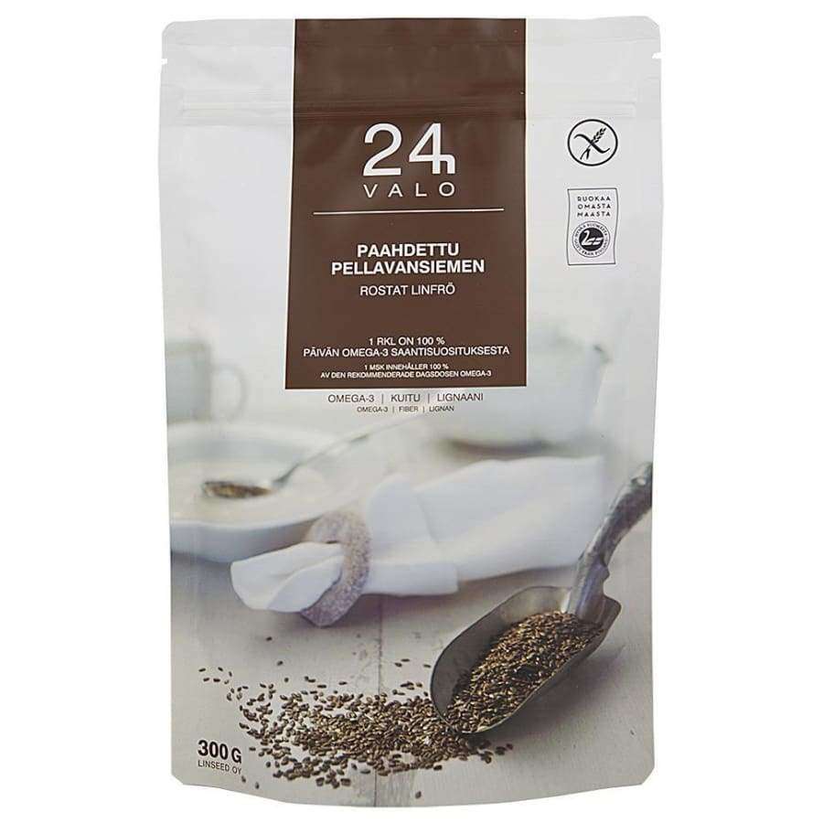 VALO24h Paahdettu pellavansiemen -pakkaus, 300 g; joustava valkoinen ja ruskea pussi mattapinnalla, pystysuuntainen suorakulmainen muoto; pakkauksessa kuva pellavansiemenistä kauhottuna metallilusikalla taitetun valkoisen lautasliinan vierellä; suurin osa painetusta tekstistä lihavoitua tekstausvapaata fonttia suomeksi; ei ihmisiä tai käsiä näkyvissä kuvassa.