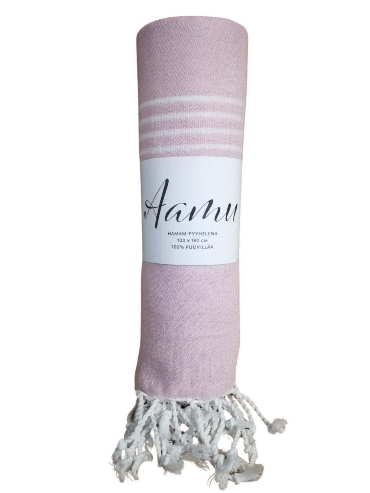 A light pink rolled towel with white stripes near the top and white fringes at the bottom, labeled “Aanu” in simple, medium-weight sans-serif text. The towel is cotton and rectangular, with a matte finish, no visible packaging. It rests on a plain surface with a neutral background. No people or hands are visible in the image.