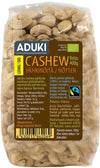 Aduki Luomu Cashewpähkinä, Fairtrade, 400 g; kirkas, joustava muovipussi; cashewpähkinät vaaleanbeigejä ja selvästi näkyvissä; etusivulla tuotetietoja ja Fairtrade-sertifiointimerkkejä suomeksi ja ruotsiksi, mattapintainen etiketti groteskityypillä; pakkaus tavanomaisen suorakulmainen; tuote kuvattu vaalealla taustalla.