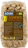 Aduki Luomu Cashewpähkinä, Fairtrade, 400 g; kirkas, joustava muovipussi; cashewpähkinät vaaleanbeigejä ja selvästi näkyvissä; etusivulla tuotetietoja ja Fairtrade-sertifiointimerkkejä suomeksi ja ruotsiksi, mattapintainen etiketti groteskityypillä; pakkaus tavanomaisen suorakulmainen; tuote kuvattu vaalealla taustalla.