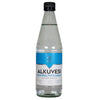 A clear glass bottle with a black cap, filled with liquid. The surface of the bottle is glossy. It has a rectangular blue and white label with bold, uppercase sans-serif text: ALKUVESI ELEKTROLYYTTIJUOMA. The cylindrical bottle stands upright on a seamless plain white background. No people or other objects are present in the shot.
