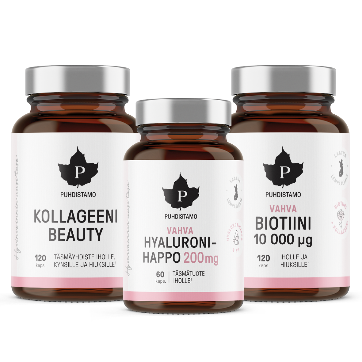 Puhdistamo Beauty Box; kolme Puhdistamo-ravintolisäpulloa — Kollageeni Beauty, Vahva Hyaluroni-Happo 200mg ja Vahva Biotiini 10 000 μg — esillä rinnakkain valkoisin etikettein ja tummanruskein kansin; lieriömäiset pullot läpinäkymätöntä materiaalia mattapinnalla; etiketeissä tuotenimet selkeällä groteskifontilla; tausta yksinkertainen ja siisti; ei ihmisiä tai käsiä kuvassa.