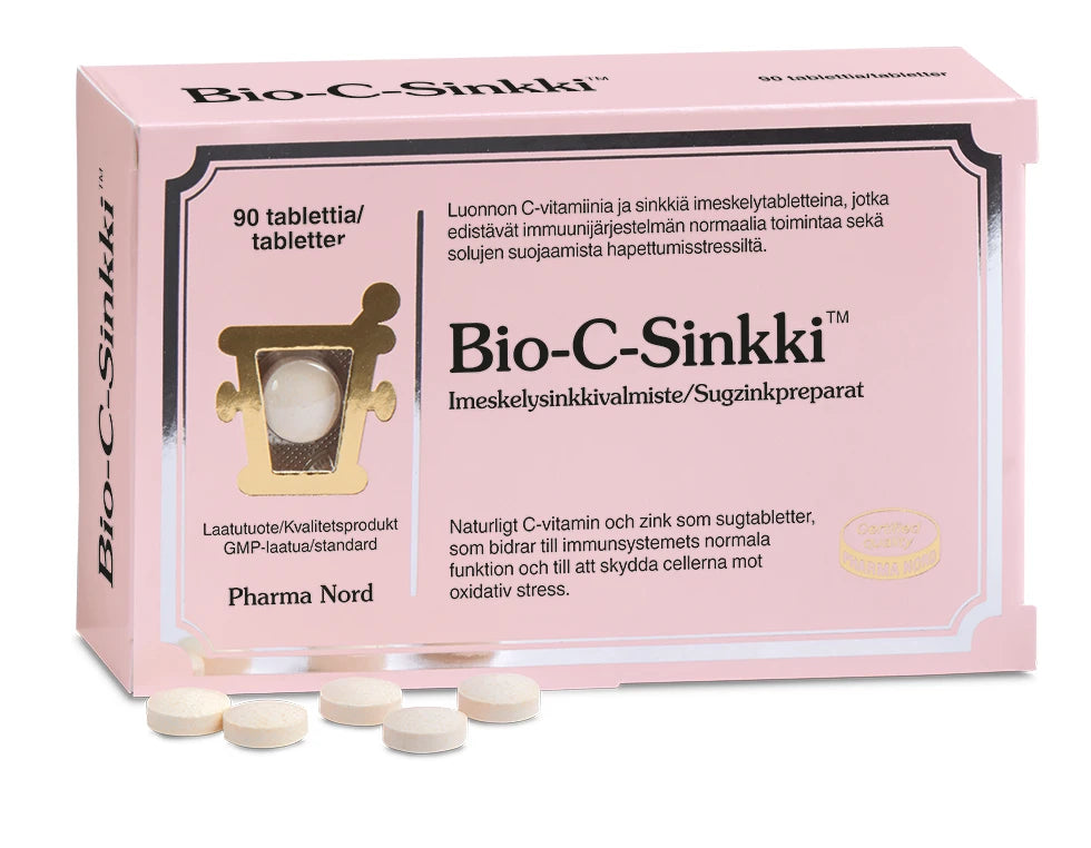 Bio-C-Sinkki -pakkaus, vaaleanpunainen suorakulmainen rasia, teksti suomeksi ja ruotsiksi sinkin hyödyistä immuunijärjestelmälle; viisi valkoista pyöreää tablettia aseteltuna rasian eteen