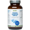 A brown bottle labeled BIOMED PREMIUM MAGNESIUM COMPLEX with supplement facts and product information displayed on a white background. The bottle is cylindrical with a matte finish and a dark, likely plastic cap. The label features sans-serif fonts in white and blue on dark backgrounds. A prominent blue crystal graphic is in the center of the label. No people or hands are visible.