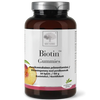 Biotin Gummies; pullo New Nordic Biotin Gummies -purutabletteja persikkakuvituksella etiketissä; muovipullo valkoisella kannella ja läpinäkyvällä rungolla, sisällä punaisia purutabletteja; mattaetiketissä pääosin groteskitekstiä mustana, valkoisena ja vihreänä; etikettiteksti mainitsee 150 g, 60 purutablettia ja skandinaavisen laadun alaosassa suomeksi ja ruotsiksi; neutraali tausta, ei ihmisiä.