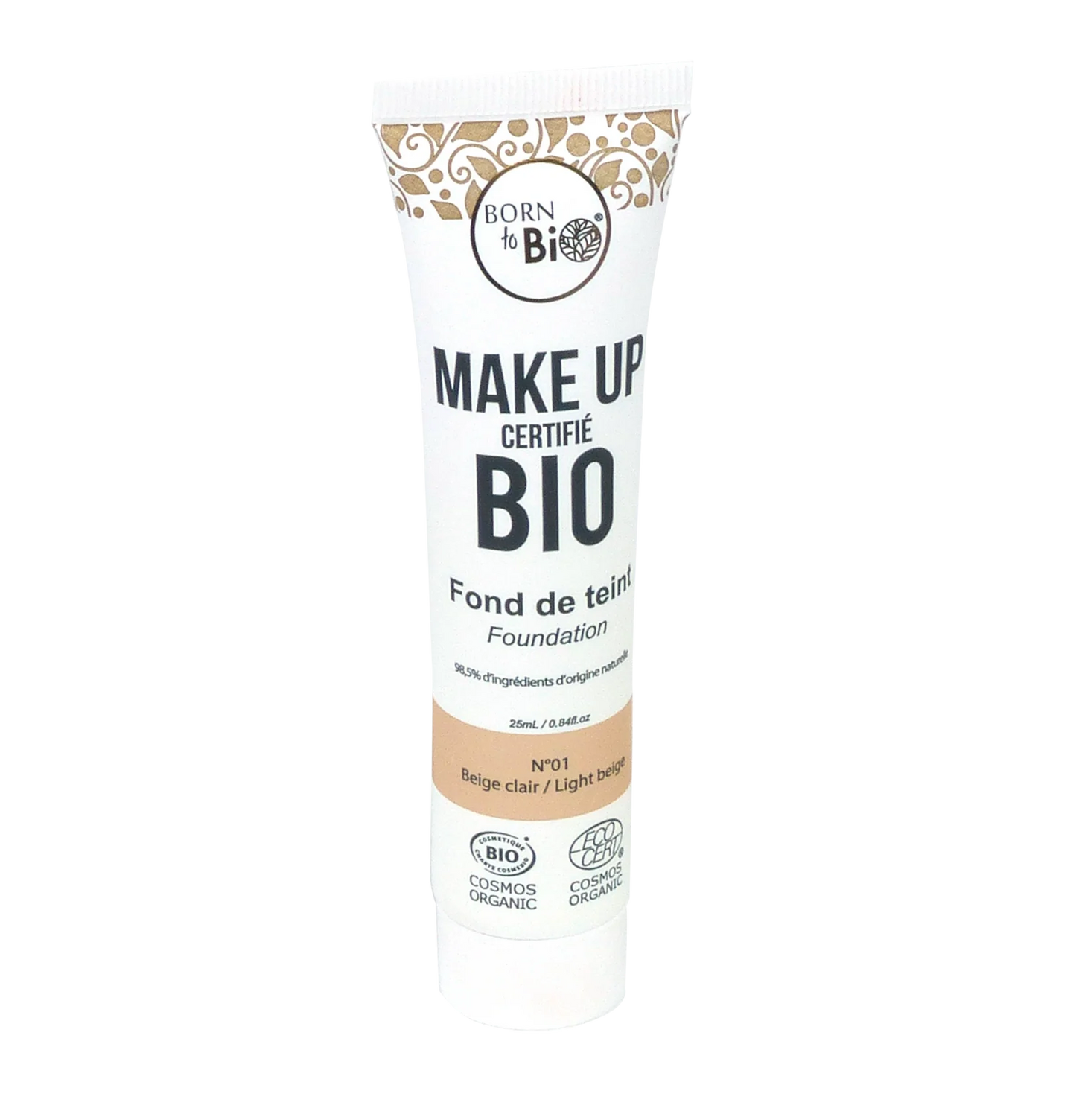 Valkoinen puristettava Born to Bio -luomumeikkivoideputkilo, 25 ml, merkitty sävyssä No. 1 Beige Clair; mattapintainen putkilo mustalla ja ruskealla painetulla ranskan- ja englanninkielisellä tekstillä, sisältää luomusertifikaattilogot ja maininnan sertifioiduista luomuraaka-aineista; typografia pääosin groteskia; tuote seisoo pystyssä yksinkertaisella taustalla, ei ihmisiä tai rekvisiittaa näkyvissä.