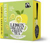 Clipper Lemon Organic Green Tea; kuvituksena sitruuna ja vihreän teen lehtiä; suorakulmainen rasia keltaisin ja vihrein mattavärein, näkyvissä Fairtrade- ja luomusertifioinnit sekä maininta 50 valkaisemattomasta, muovittomasta teepussista; teksti lihavoitua ja groteskia valkoisena ja mustana; rasia tavallisella pinnalla, ei ihmisiä tai käsiä.
