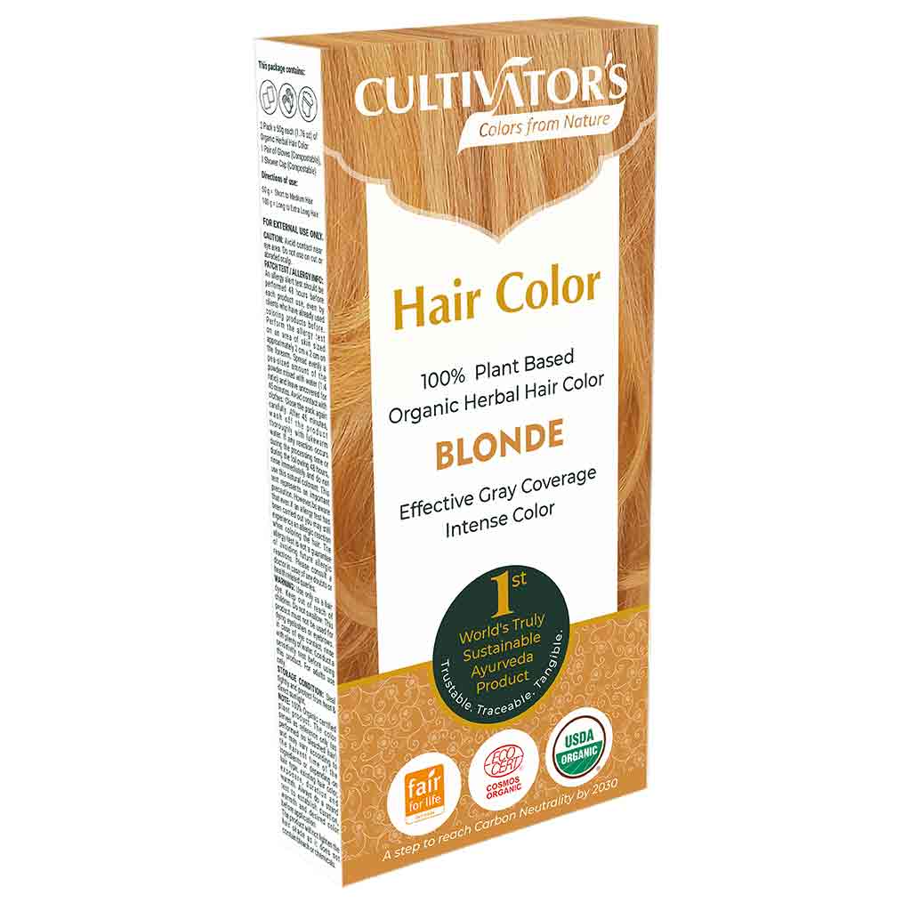Cultivators Kasvihiusväri Blonde -pakkaus; suorakulmainen, mattapintainen rasia maanläheisissä sävyissä vihrein korostuksin; etiketissä teksti tuotteen 100-prosenttisesta kasviperäisyydestä, luomulaadusta ja tehokkaasta harmaan peittävyydestä; useita ekosertifiointimerkkejä selkeällä tekstausvapaalla kirjasimella; kuvattu valkoista taustaa vasten tasaisessa valaistuksessa, ei ihmisiä tai käsiä näkyvissä.