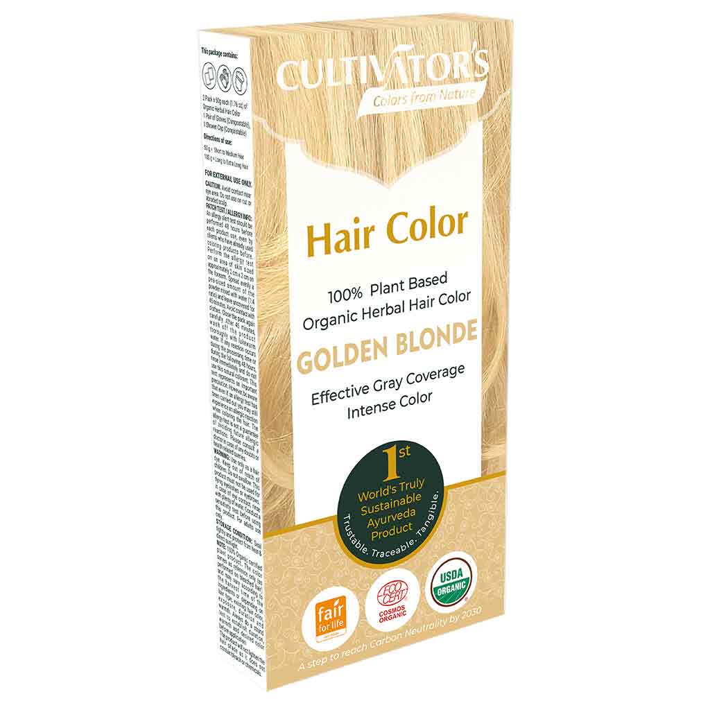 Cultivators Kasvihiusväri Golden Blonde -pakkaus; suorakulmainen, mattapintainen pahvirasia beigen ja kullanvärin sävyissä; etiketissä luomusertifiointi-ikoneita sekä pyöreä merkki tekstillä "Worlds Truly Sustainable and Advanced Product"; pääteksti lihavoidulla päätekirjasimella; kuvattu valkoista taustaa vasten, ei ihmisiä tai muita esineitä.