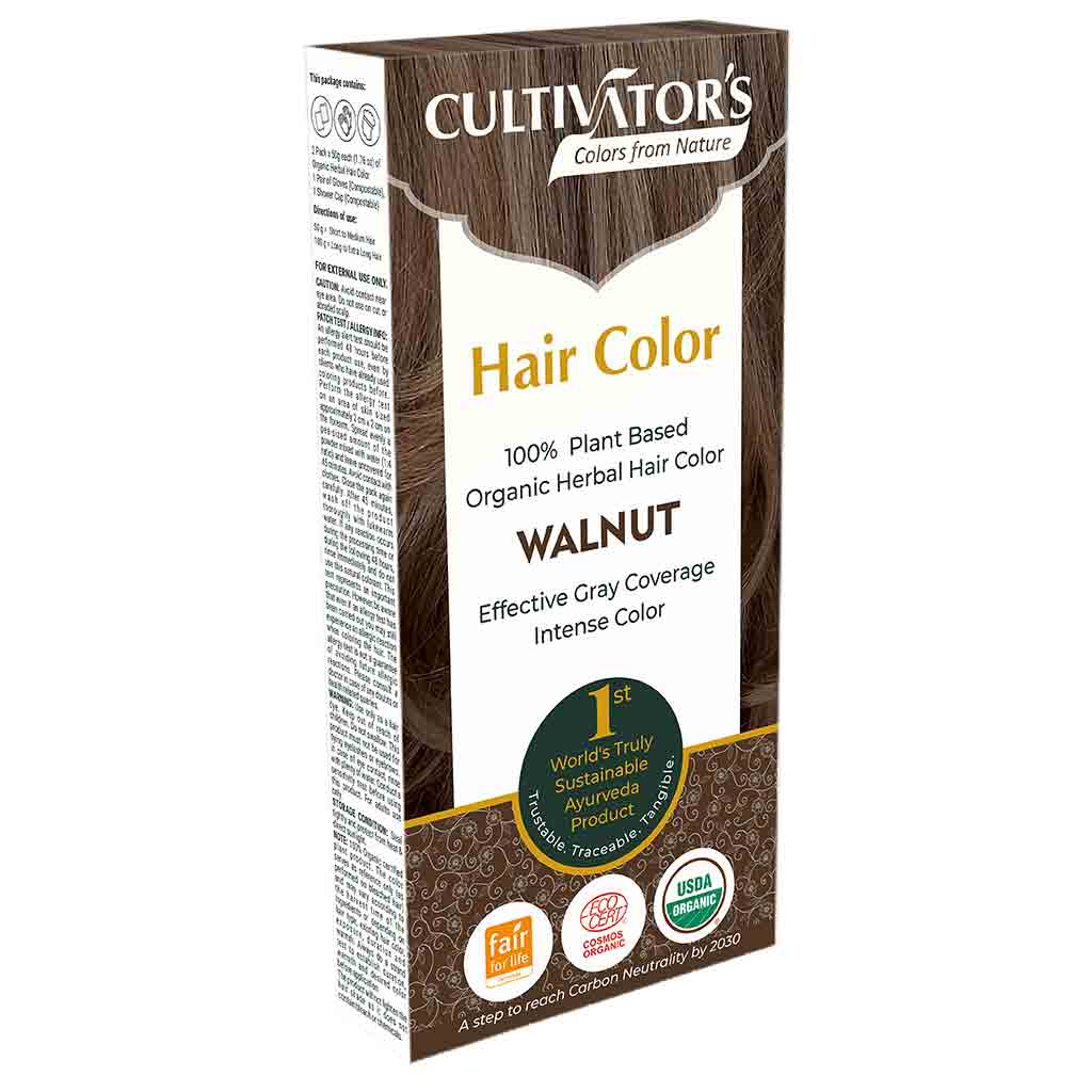 Cultivators Kasvihiusväri Walnut -pakkaus; suorakulmainen, mattapintainen pahvirasia pääosin valkoisena vihrein ja ruskein korostuksin; etiketissä Fair for Life- ja USDA Organic -sertifiointimerkkejä sekä tekstiä tuotteen 100-prosenttisesta kasviperäisyydestä ja tehokkaasta harmaan peittävyydestä; tuotenimi lihavoidulla kirjasimella; kuvattu yksiväristä taustaa vasten, ei ihmisiä tai muita esineitä.