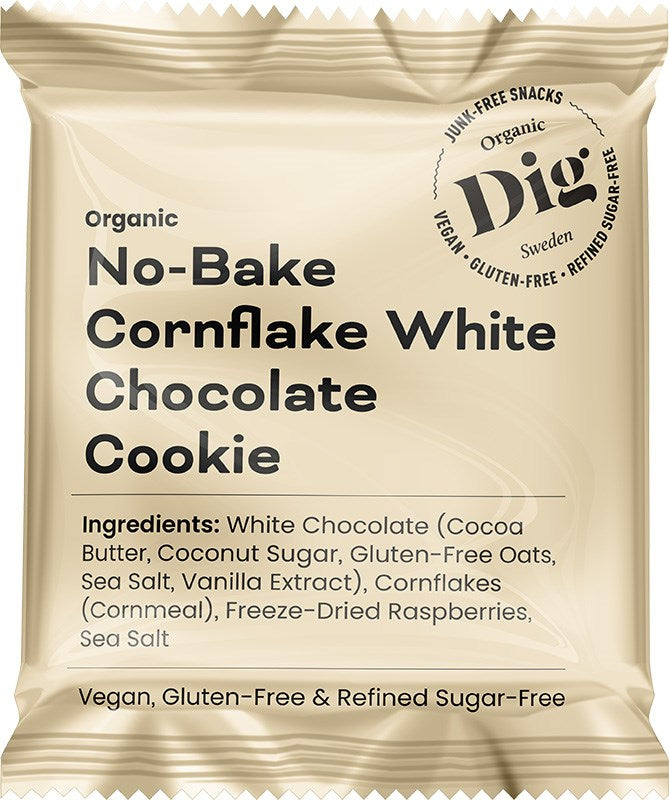 A beige snack wrapper with a matte finish is shown, labeled “Organic No-Bake Cornflake White Chocolate Cookie.” The wrapper displays ingredient and dietary information in clear, sans-serif fonts, listing vegan, gluten-free, and refined sugar-free. The package is rectangular, no people or backgrounds are visible. A beige snack wrapper labeled Organic No-Bake Cornflake White Chocolate Cookie features ingredient and diet information, highlighting its vegan, gluten-free, and refined sugar-free qualities.