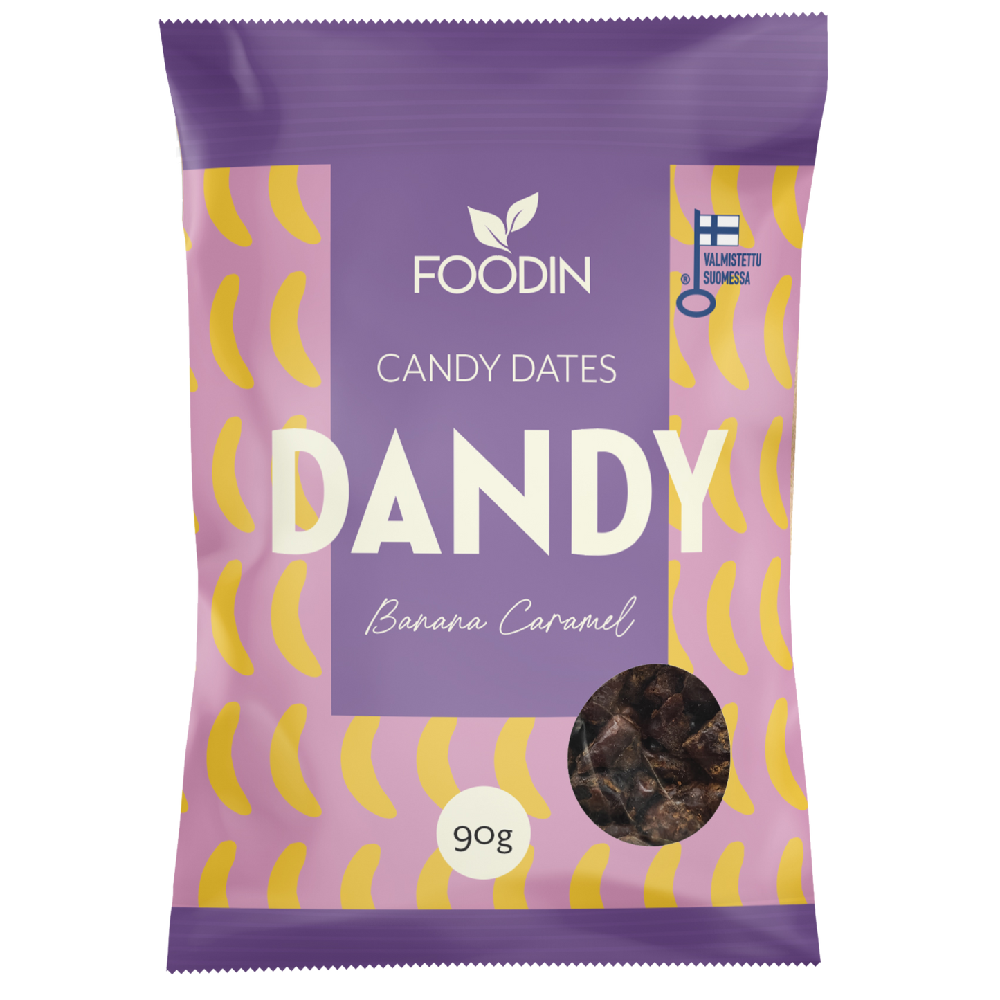 Foodin Dandy Candy Dates Banana Caramel; violetti mattapintainen pussi Foodin Dandy Candy -taateleita, Banana Caramel -maku, 90 g; etusivulla tyyliteltyjä keltaisia banaanikuvia ja kirkas ikkuna, josta osa sisällöstä näkyy; oikeassa yläkulmassa Suomen lipun kuvake ja teksti ”valmistettu Suomessa”; tausta tasainen ja neutraali; suora tuotekuva ilman ihmisiä tai käsiä.
