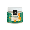 A jar of Foodin Green Superfood Tropical Energy powder, 120g, with a green plastic body and black screw-on lid. The label is matte, combining orange and green colors with flat illustrations of leafy greens, small carrots, and an orange slice. Sans-serif text states the product name and weight. Plain white background. Shot shows only the sealed jar upright on a flat surface.